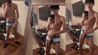 Hung twink jerks off in mirror with nipple clamps gagging his cock