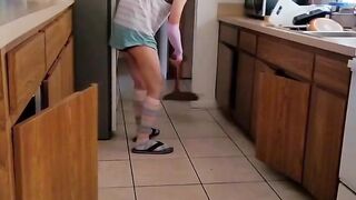 Twink undresses while cleaning teased with thong barely hiding