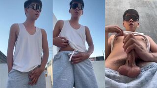 Asian cutie in grey sweatpants jerks off his veiny cock while moaning