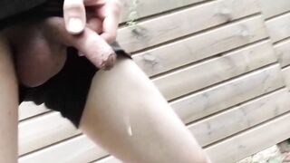 Gay boy pisses pee under rainbow in summer rain