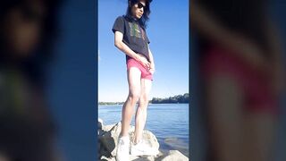 Twink boy in glasses cap sneakers pisses long dark hair down the river summer gay nature outdoor piss solo