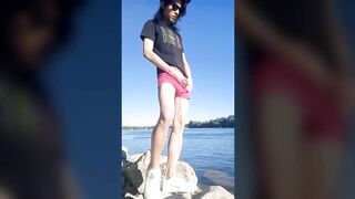 Twink boy in glasses cap sneakers pisses long dark hair down the river summer gay nature outdoor piss solo