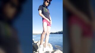 Twink boy in glasses cap sneakers pisses long dark hair down the river summer gay nature outdoor piss solo