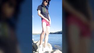 Twink boy in glasses cap sneakers pisses long dark hair down the river summer gay nature outdoor piss solo