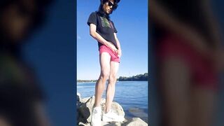 Twink boy in glasses cap sneakers pisses long dark hair down the river summer gay nature outdoor piss solo