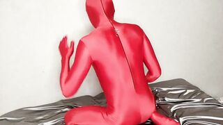 Red zentai suit crushed by bulging penis case