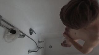 Gay Asian twink takes a big dick shower and lets cum soak his phimosis