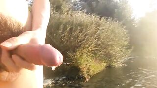 Twink wanks his hairy dick in public streams cum rivers