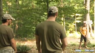 Muscle daddies thrash muscled twink until piss and cum soak camp floor