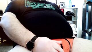 Thick bear jacks off in red briefs squirting cum all over black shirt