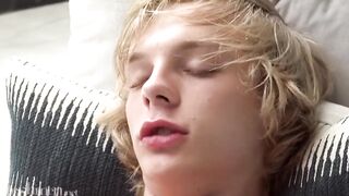 Cute blond twink jerks off with that uncut big cock till he blows a load