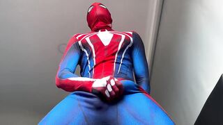 Horny Spiderman shoots thick ropes of gay cum on suit while edging handjob
