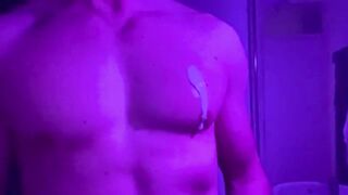 Muscle God lets cum drip down his thick cock while oiled up