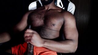 Bear muscle strokes his own thick cock in black Hanes boxers until he gushes thick cum