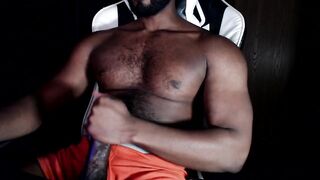 Bear muscle strokes his own thick cock in black Hanes boxers until he gushes thick cum