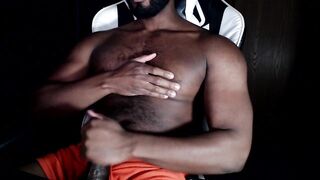 Bear muscle strokes his own thick cock in black Hanes boxers until he gushes thick cum
