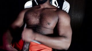 Bear muscle strokes his own thick cock in black Hanes boxers until he gushes thick cum