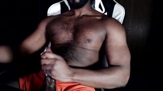 Bear muscle strokes his own thick cock in black Hanes boxers until he gushes thick cum