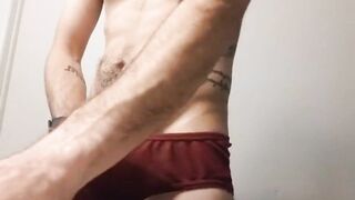 Tattooed twink destroys his underwear with massive cumshot
