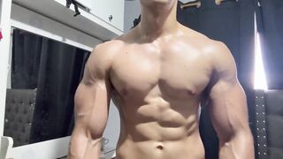 Muscle jock flexing sweaty biceps until he gets destroyed by his own flex