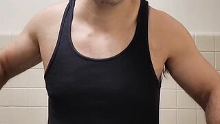 Flexing hairy muscle bear in tank top destroyed in gay body worship