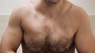 Flexing hairy muscle bear in tank top destroyed in gay body worship