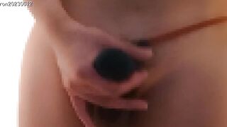 Japanese guy jerks off in pants with balls popping out