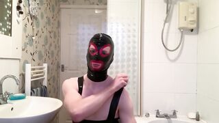 Bisexual gimp boy teases latex fetish cock sheath alone