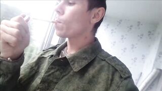 Russian soldier smokes spits jerks his cock cumming all over his army boots