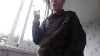 Russian soldier smokes spits jerks his cock cumming all over his army boots