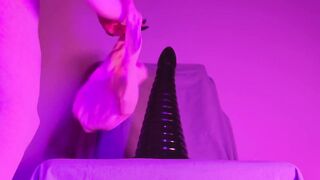 Femme twink rides biggest tower dildo deep in her tight asshole