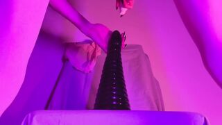 Femme twink rides biggest tower dildo deep in her tight asshole