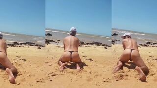 Hot gay beach femboy gets caught in tiny panties by voyeur