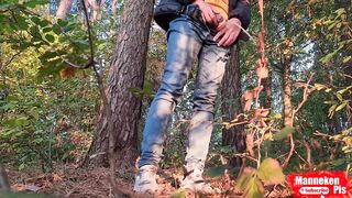 Long steaming twink pissing in gay forest under jeans