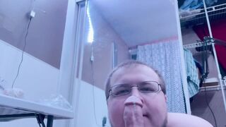 Chubby bear takes big black dildo deep throat