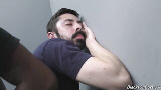 Bearded white man slurping black cock at gloryhole