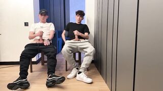 Two lads jerking off uncut dicks with big cum loads