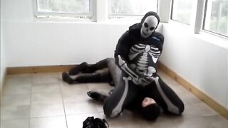 Gay skeleton gets destroyed by frogman in spandex wrestling cumshot