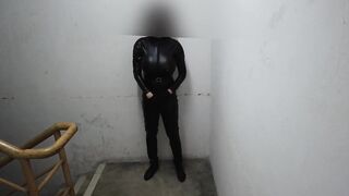 Latex bodysuit dude chokes on his own cum on staircase