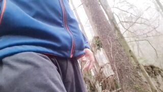 naked guy jerks off in forest until thick cum drips down his shaft