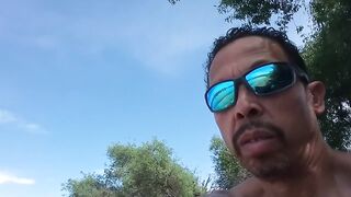 Muscular exhibitionist masturbating naked outside in front of shocked onlookers