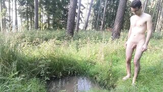 Twink strips naked in the forest smears mud all over his tight body