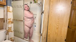 Bear squeezing out in steaming shower mess