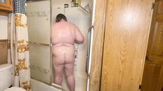 Bear squeezing out in steaming shower mess